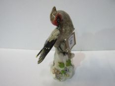 Continental china bird figurine. Estimate £90-110.