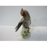 Continental china bird figurine. Estimate £90-110.