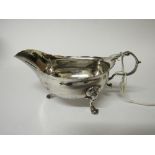18th century Irish silver sauce boat on 3 legs with faint crest of a cockerel, Dublin (believed