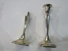 A pair of silver candlesticks (1x a/f), Chester, 1923, 20cms tall. Estimate £10-20.