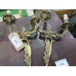 4x 2 branch gilded decorative metal wall lamps. Estimate £20-40.