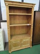 Large solid pine shelf unit with cupboard to base, 204cms x 114cms x 58cms. Estimate £40-60.