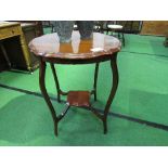 Mahogany shaped-edge display table on carved tapered legs. Estimate £20-30.