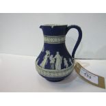 An early Jasper-style Wedgwood jug, height 18cms. Estimate £30-40.