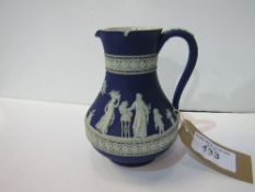 An early Jasper-style Wedgwood jug, height 18cms. Estimate £30-40.