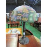 Metal table lamp with decorated ceramic shade