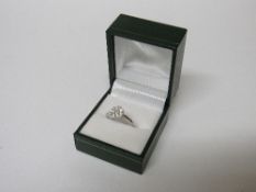 18 carat white gold diamond cluster ring, approx 1 carat, size M, weight 3.4gms. Estimate £540-560.