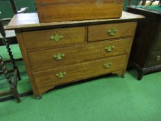 Oak chest of 2 over 2 drawers on casters, 105cms x 46cms x 69cms. Estimate £20-40.