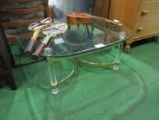 A glass, brass & lucite low table, 98cms x 99cms x 40cms. Estimate £30-40.