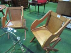 A pair of oak War Department 'Glastonbury' chairs. Estimate £80-120.