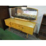 Meredew furniture 1950's style dressing table c/w mirror, 152cms x 47cms x 128cms. Estimate £10-20.