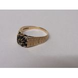 9ct gold ring set with black stones, size S, 3.2 gms. Estimate £30-40.