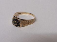 9ct gold ring set with black stones, size S, 3.2 gms. Estimate £30-40.