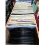 Box of '80/90's singles, approx 100, including 2 tones, rock etc. Estimate £50-60.