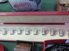 Boxed set of 12 continental silver & glass toddy cups in original box. Estimate £90-140.