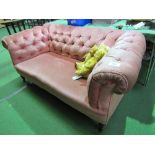 Pink upholstered button framed Chesterfield-style sofa, 170cms x 83cms x 71cms. Estimate £30-50.