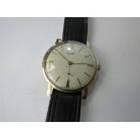 9ct gold cased Everite watch with leather strap. Estimate £150-160.