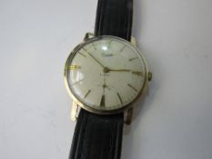 9ct gold cased Everite watch with leather strap. Estimate £150-160.