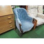 Victorian carved frame blue upholstered armchair on casters. Estimate £30-40.