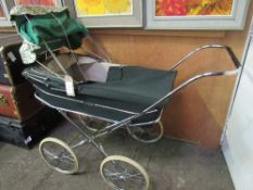 1970's Marmet green pram c/w parasol & seat. Estimate £20-30.