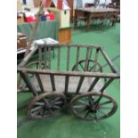 Small 4 wheel hand-drawn cart with slatted sides. Estimate £50-100.