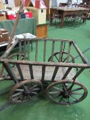 Small 4 wheel hand-drawn cart with slatted sides. Estimate £50-100.