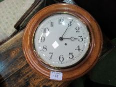 Large oak cased dial wall clock, in working order, 48cms diameter. Estimate £50-80.