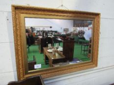 Gilt frame wall mirror, 94cms x 68cms. Estimate £5-10.