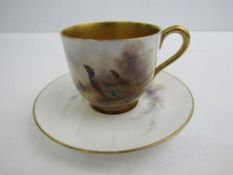 Royal Worcester porcelain coffee cup and saucer decorated with pheasants, with heavily gilded