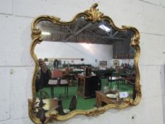 Ornate framed wall mirror, 80cms x 70cms. Estimate £10-20.