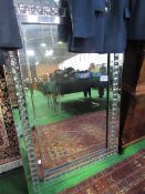 Large mirror with pattern glass surround, 80cms x 121cms. Estimate £20-30.