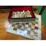 Onyx chess set & board with pieces in decorative box. Estimate £30-40.