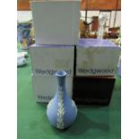 5 Wedgwood Jasperware vases in original boxes. Estimate £10-20.