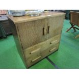 Oak cabinet of cupboard over 2 drawers, 1950's style, 94cms x 51cms x 93cms. Estimate £20-40.