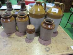6 stoneware jars. Estimate £20-30.