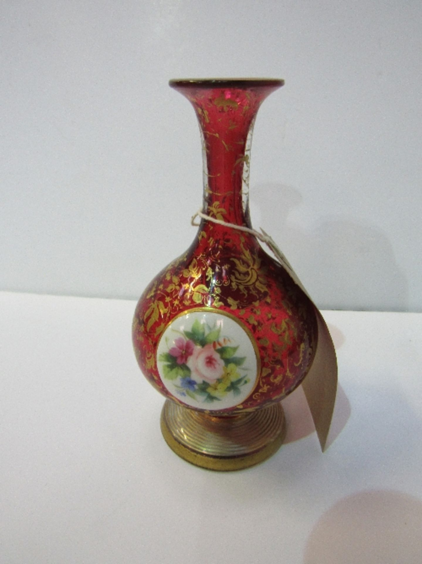 Bohemian Ruby glass vase with gilt overlay with hand-painted miniature of a girl & flowers. Estimate
