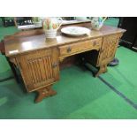 Oak 1930's style dressing table, 146cms x 45cms x 133cms. Estimate £10-20.