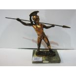 Bronze finish Grecian Warrior with spear on variegated marble base. Estimate £10-20.