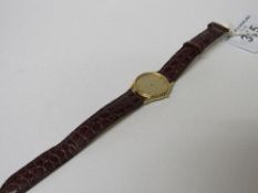 Omega Deville watch with gold plated case & a leather strap. Estimate £135-160.