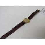Omega Deville watch with gold plated case & a leather strap. Estimate £135-160.