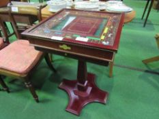 Mahogany Monopoly games table on pedestal c/w game pieces. Estimate £100-120.