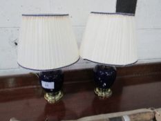 Pair of blue cream ceramic & brass table lamps & shades. Estimate £5-10.