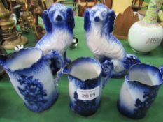 2 blue & white Staffordshire-style dogs & 3 blue & white graduated jugs