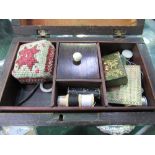 Small rosewood sewing box c/w contents including ivory handled tools. Estimate £20-30.