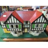 Large Tri-ang 1930's dolls house. Estimate £40-60.