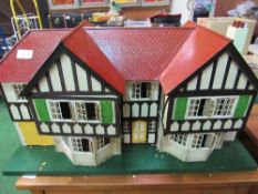 Large Tri-ang 1930's dolls house. Estimate £40-60.