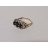 9ct gold ring set with 3 black stones surrounded by diamond chips, 2.3 gms, size M. Estimate £30-