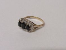 9ct gold ring set with 3 black stones surrounded by diamond chips, 2.3 gms, size M. Estimate £30-