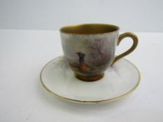 Royal Worcester porcelain coffee cup and saucer decorated with pheasants, with heavily gilded