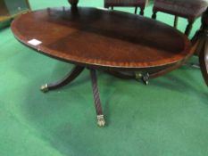 Mahogany oval top coffee table on centre pedestal to casters, 112cms x 67cms x 48cms. Estimate £10-